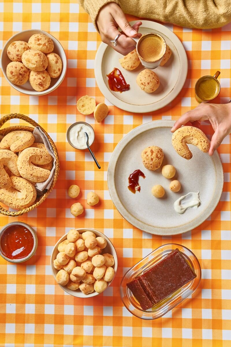 Cheese bread and coffee spread on a gingham table