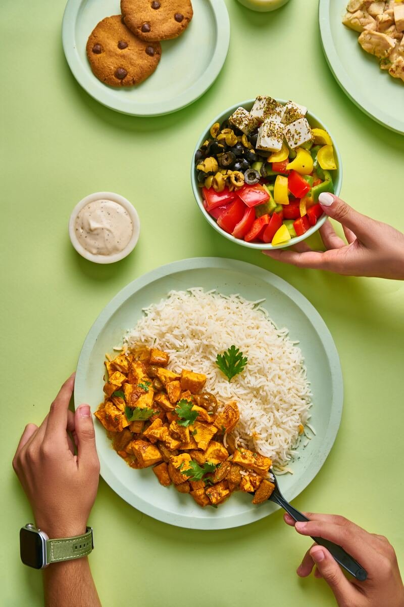 Chicken curry with rice and a mezze salad bowl