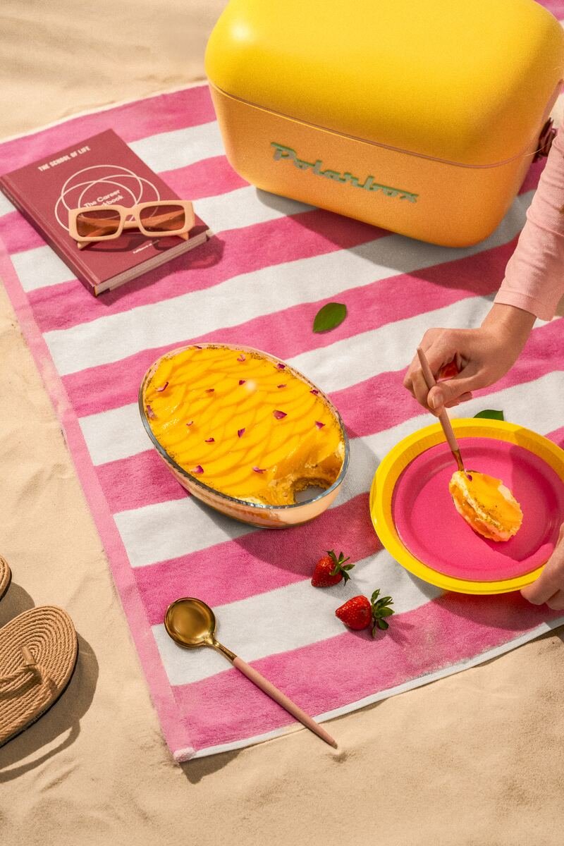 Mango dessert on a striped beach towel