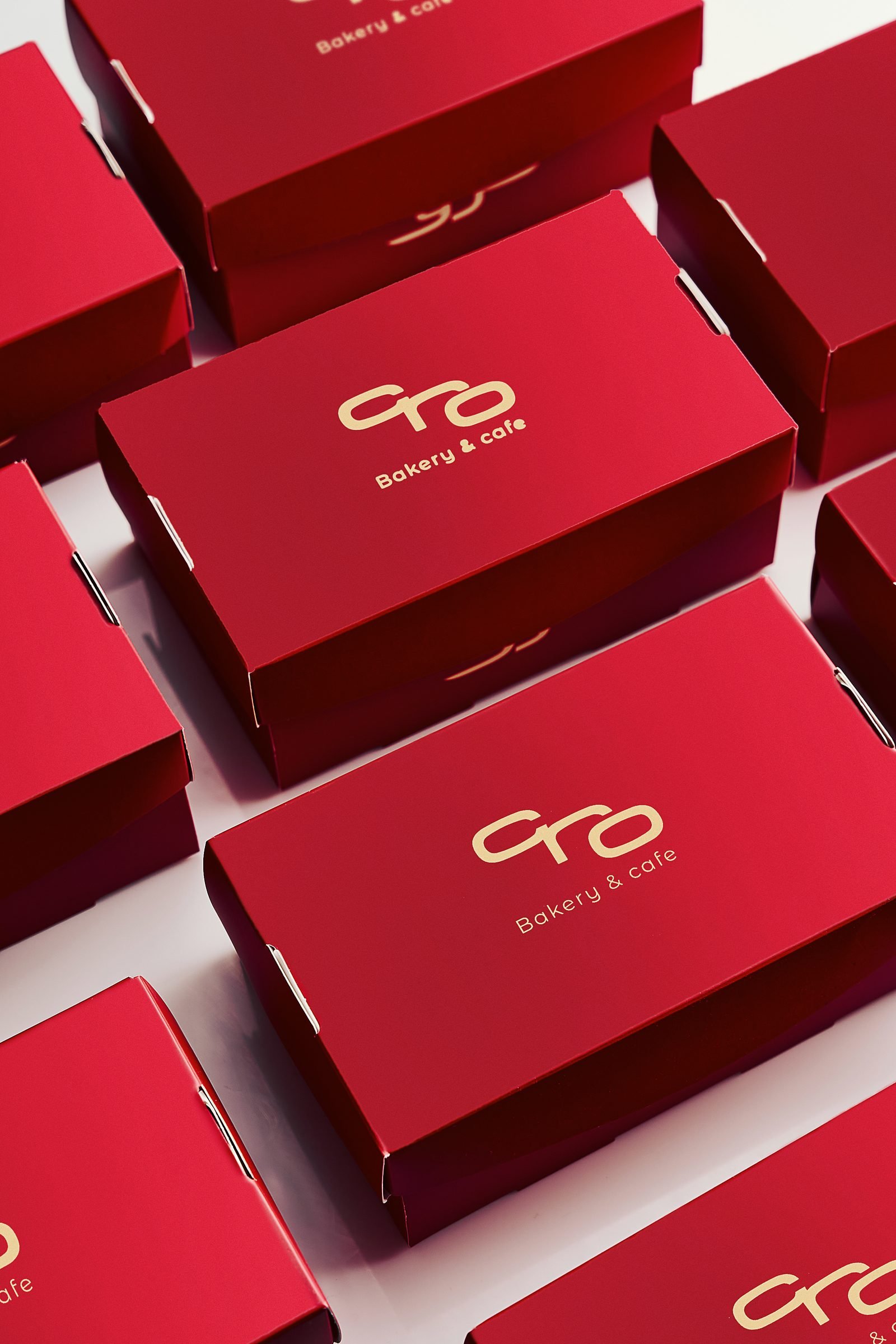 Stack of red Cro bakery boxes