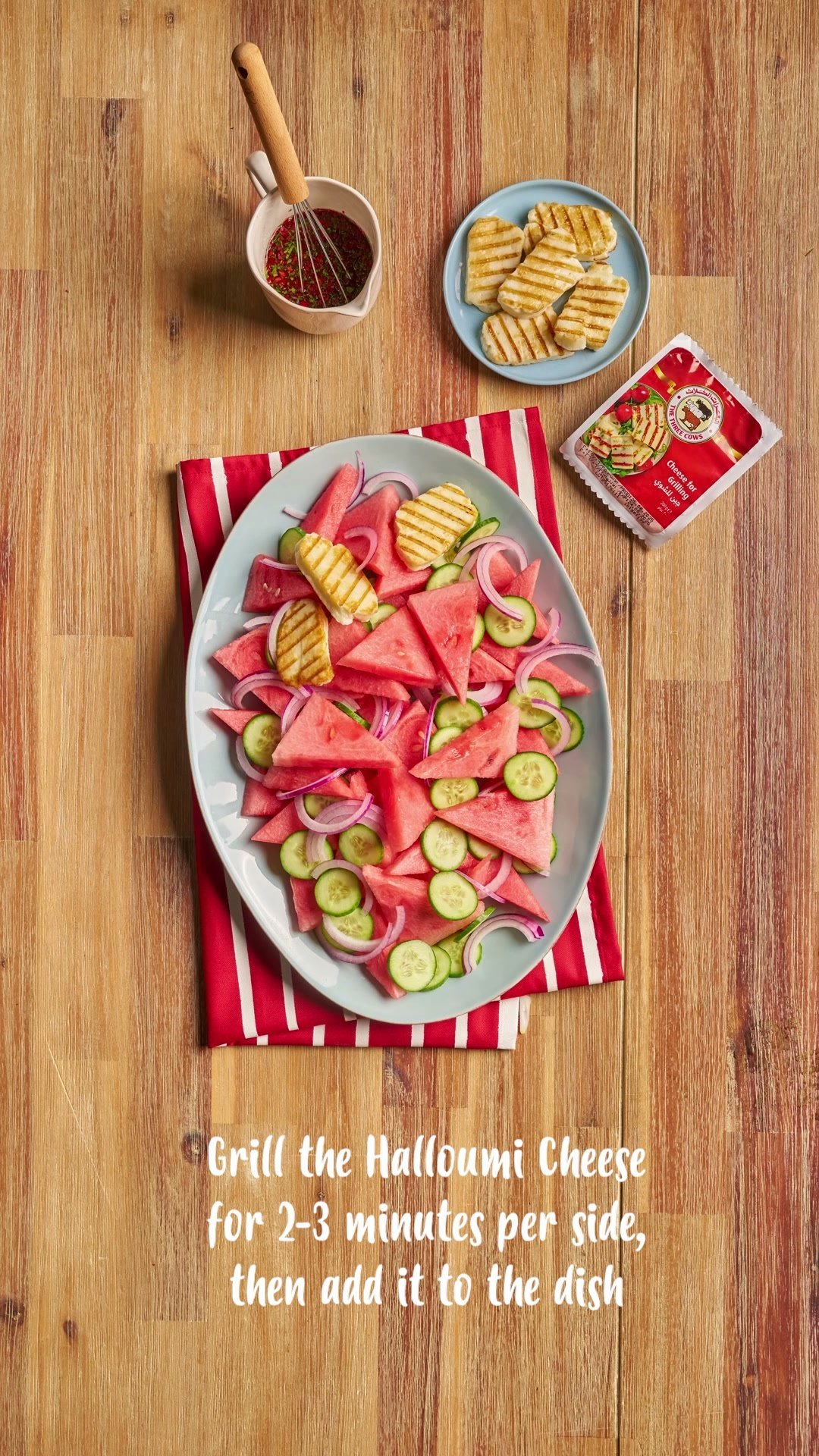 Overhead of grilled halloumi and watermelon salad, the grilling instruction across the frame